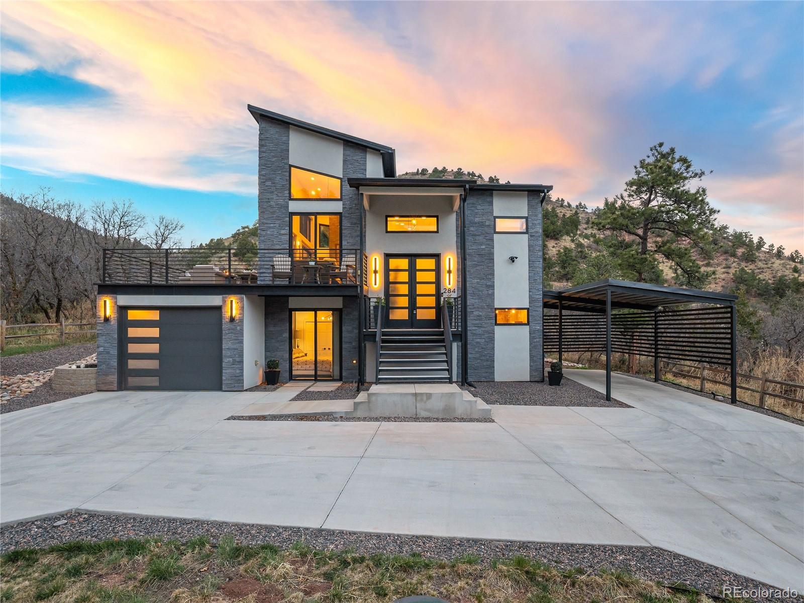 284 Crystal Park Road Manitou Springs, CO 80829 - Photo 1 of 39 a view of a house with entertaining space