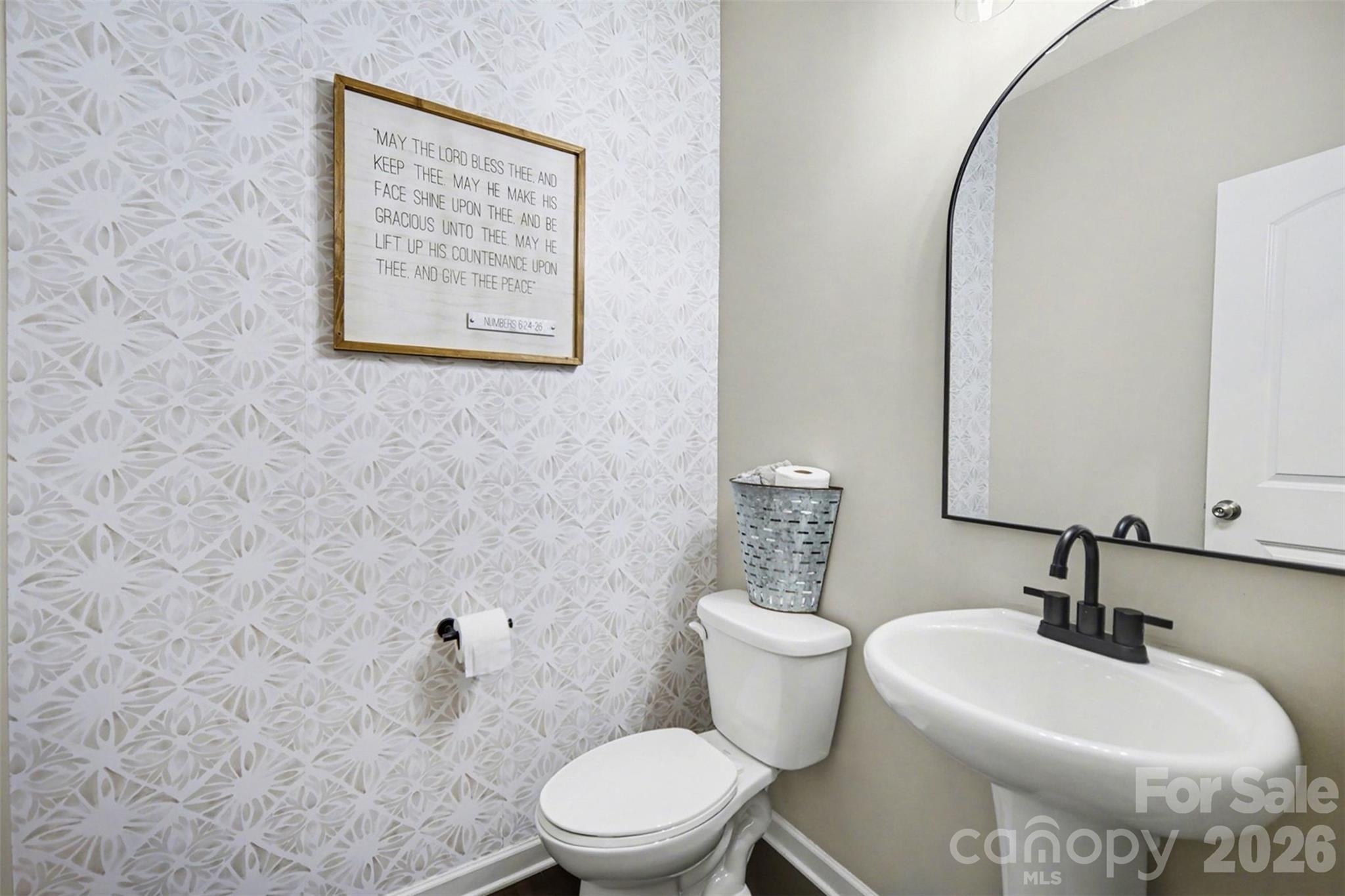514 Tack Lane Midland, NC 28107 - Photo 8 of 48 a bathroom with a toilet sink and mirror