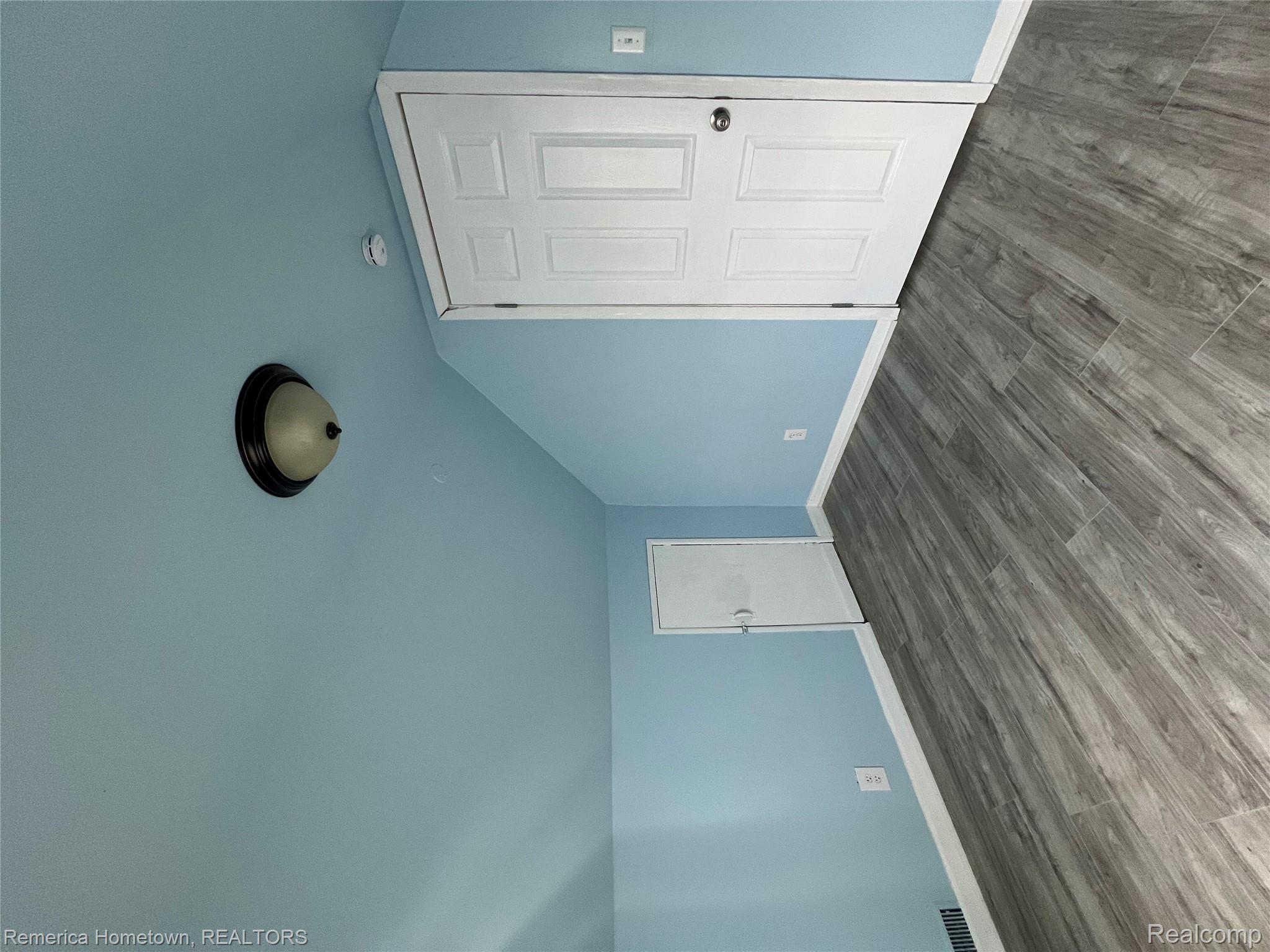 26159 Stanford Street Inkster, MI 48141 - Photo 15 of 16 Additional living space with wood finished floors and vaulted ceiling