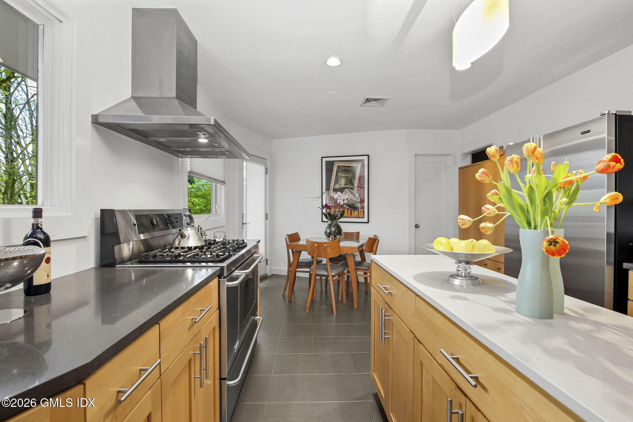185 Valley Road Cos Cob, CT 06807 - Photo 17 of 38 a kitchen with stainless steel appliances granite countertop sink stove top oven and cabinets