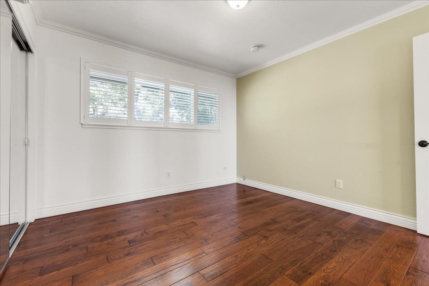 15 Mentone Road Carmel, CA 93923 - Photo 23 of 47 a view of an empty room with wooden floor and a window