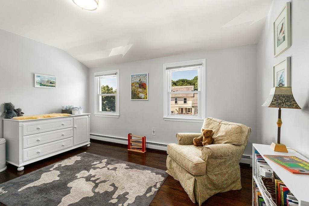 103 Stimson Street Boston, MA 02132 - Photo 15 of 26 a room with furniture and a window