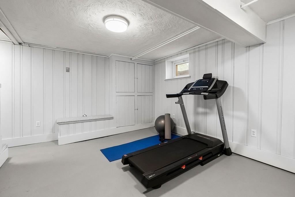 103 Stimson Street Boston, MA 02132 - Photo 18 of 26 a room with gym equipment