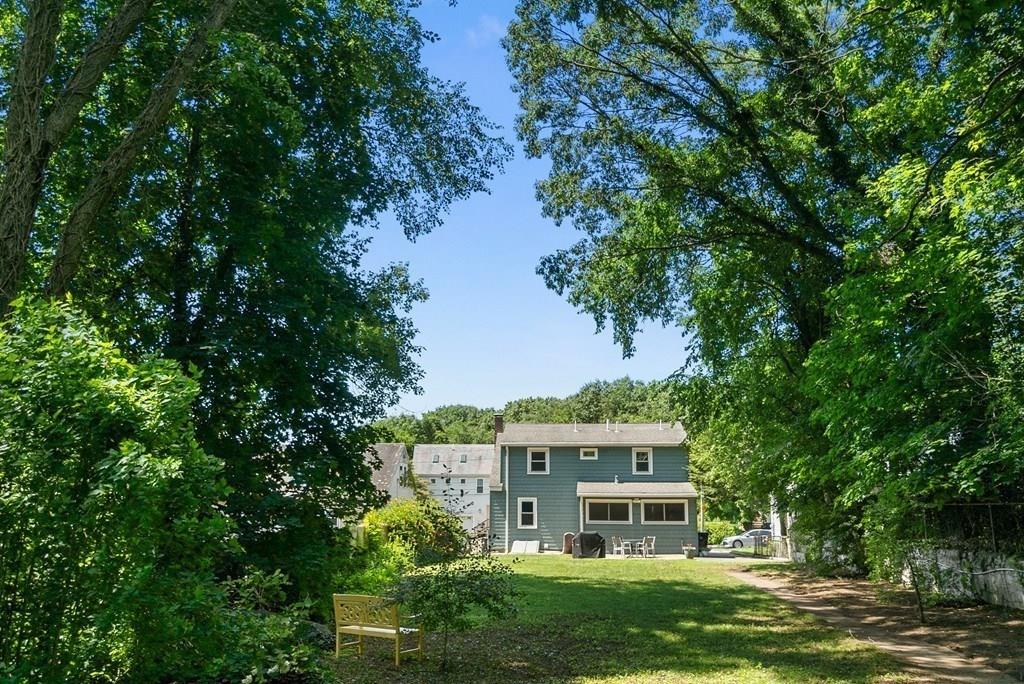 103 Stimson Street Boston, MA 02132 - Photo 21 of 26 a front view of a house with a garden