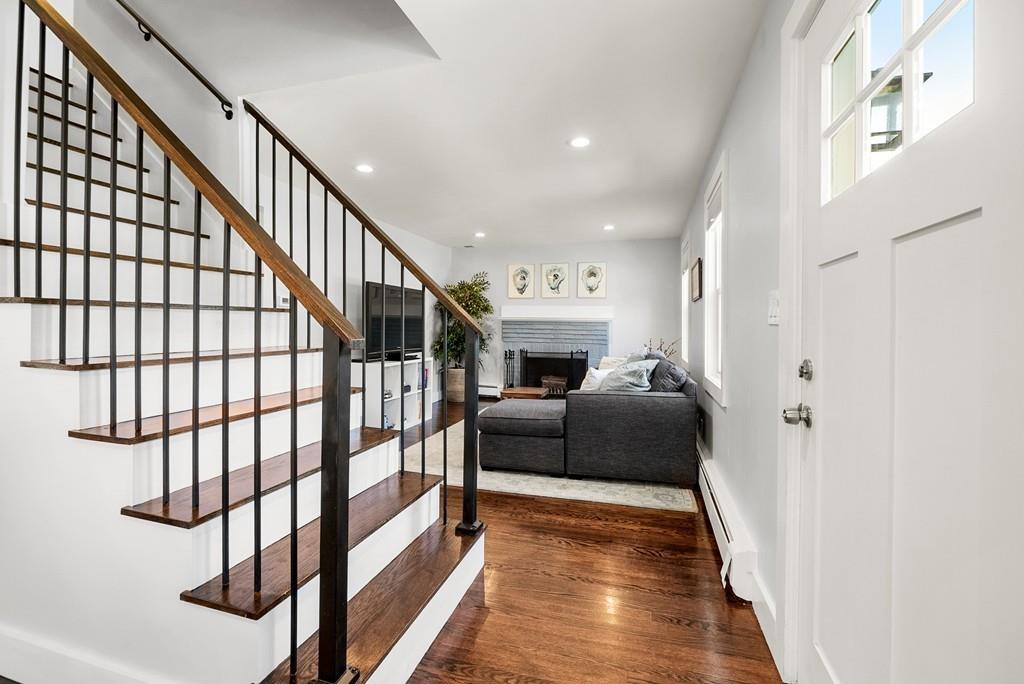103 Stimson Street Boston, MA 02132 - Photo 7 of 26 a living room with furniture and a wooden floor