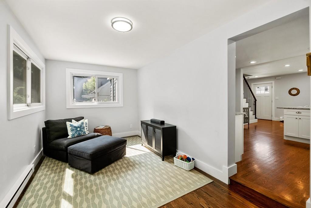 103 Stimson Street Boston, MA 02132 - Photo 8 of 26 a living room with furniture and a flat screen tv