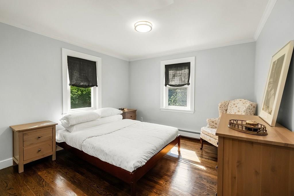 103 Stimson Street Boston, MA 02132 - Photo 9 of 26 a bedroom with a bed and a window