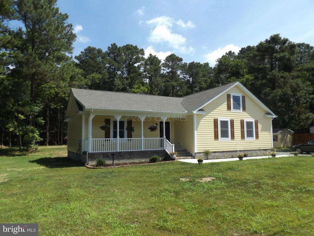 27100 Mt Vernon Road Princess Anne, MD 21853 - Photo 2 of 22 a front view of a house with a yard