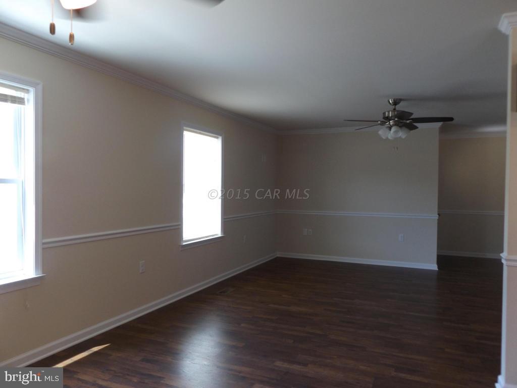 27100 Mt Vernon Road Princess Anne, MD 21853 - Photo 12 of 22 an empty room with wooden floor and windows