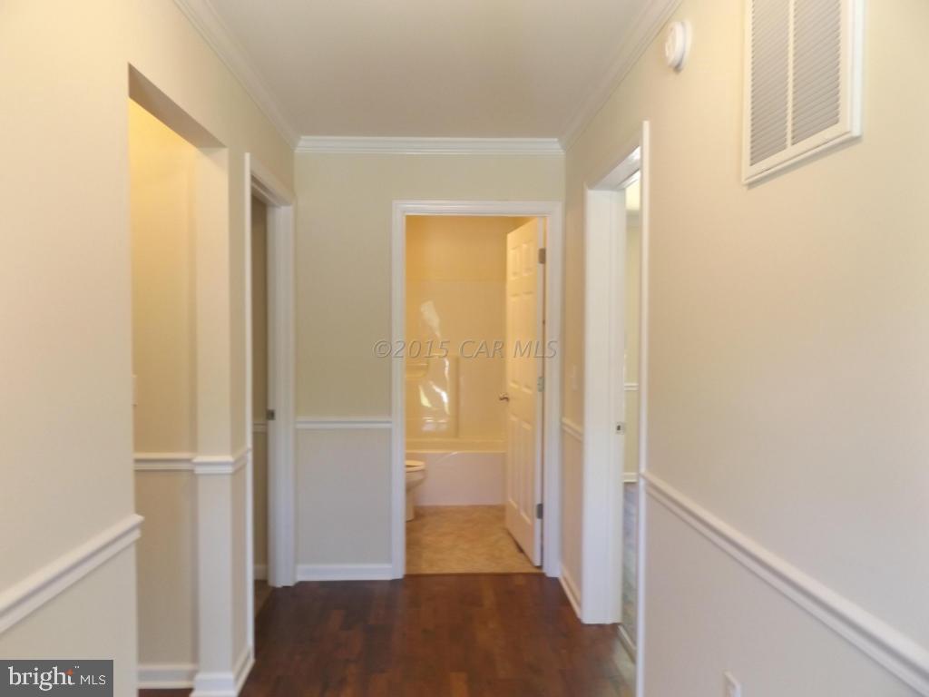 27100 Mt Vernon Road Princess Anne, MD 21853 - Photo 13 of 22 a view of hallway with wooden floor