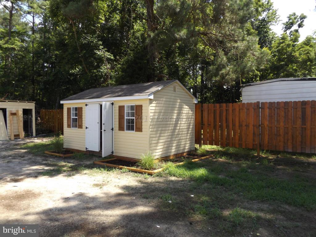 27100 Mt Vernon Road Princess Anne, MD 21853 - Photo 20 of 22 a front view of a house with a yard