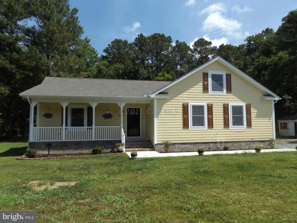 27100 Mt Vernon Road Princess Anne, MD 21853 - Photo 3 of 22 a front view of a house with a garden