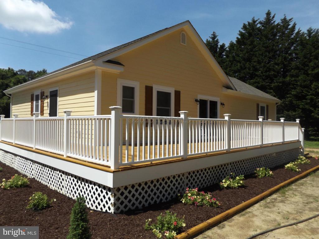 27100 Mt Vernon Road Princess Anne, MD 21853 - Photo 5 of 22 a front view of a house with a deck