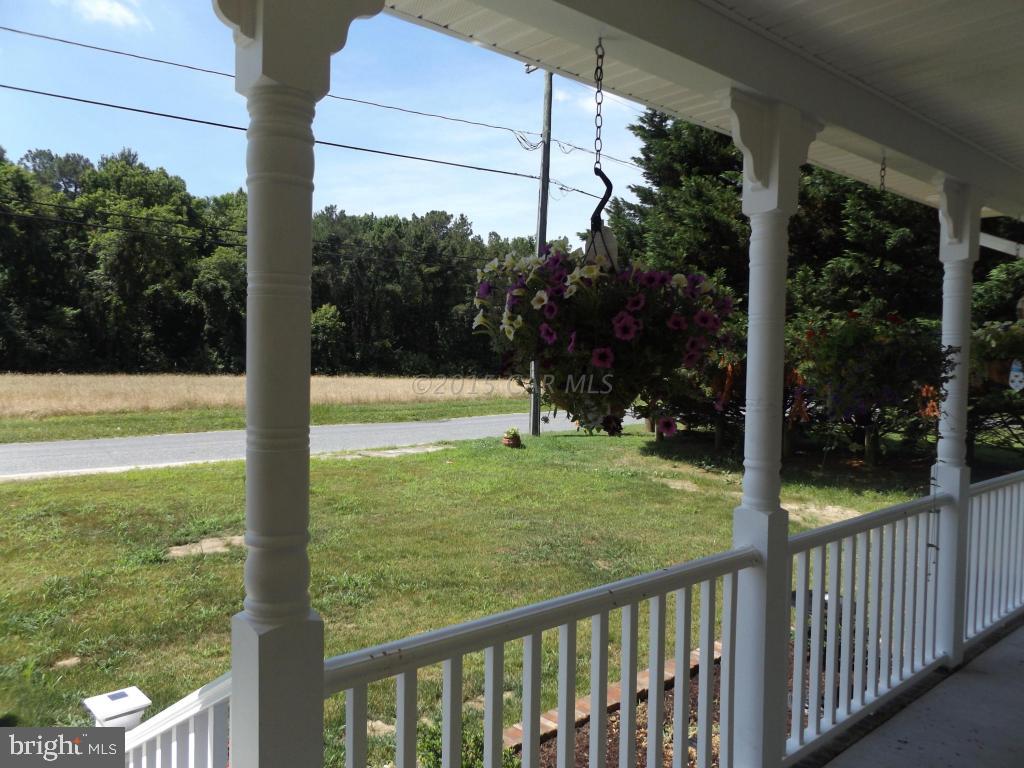 27100 Mt Vernon Road Princess Anne, MD 21853 - Photo 7 of 22 a view of a porch with a yard