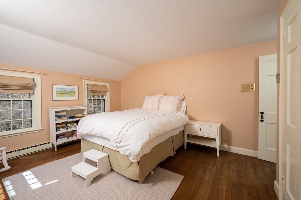 35 Lantern Lane Cohasset, MA 02025 - Photo 15 of 20 a bed room with a bed and a chair