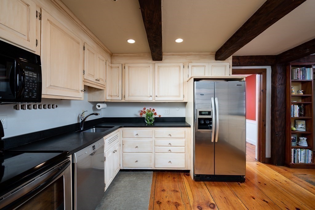 35 Lantern Lane Cohasset, MA 02025 - Photo 7 of 20 a kitchen with granite countertop a refrigerator and a stove top oven
