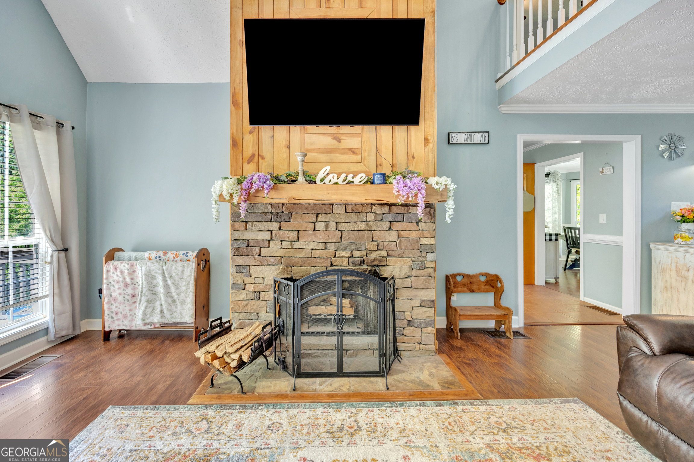 115 Crestview Lane Newborn, GA 30056 - Photo 13 of 53 a living room with furniture wooden floor and a flat screen tv