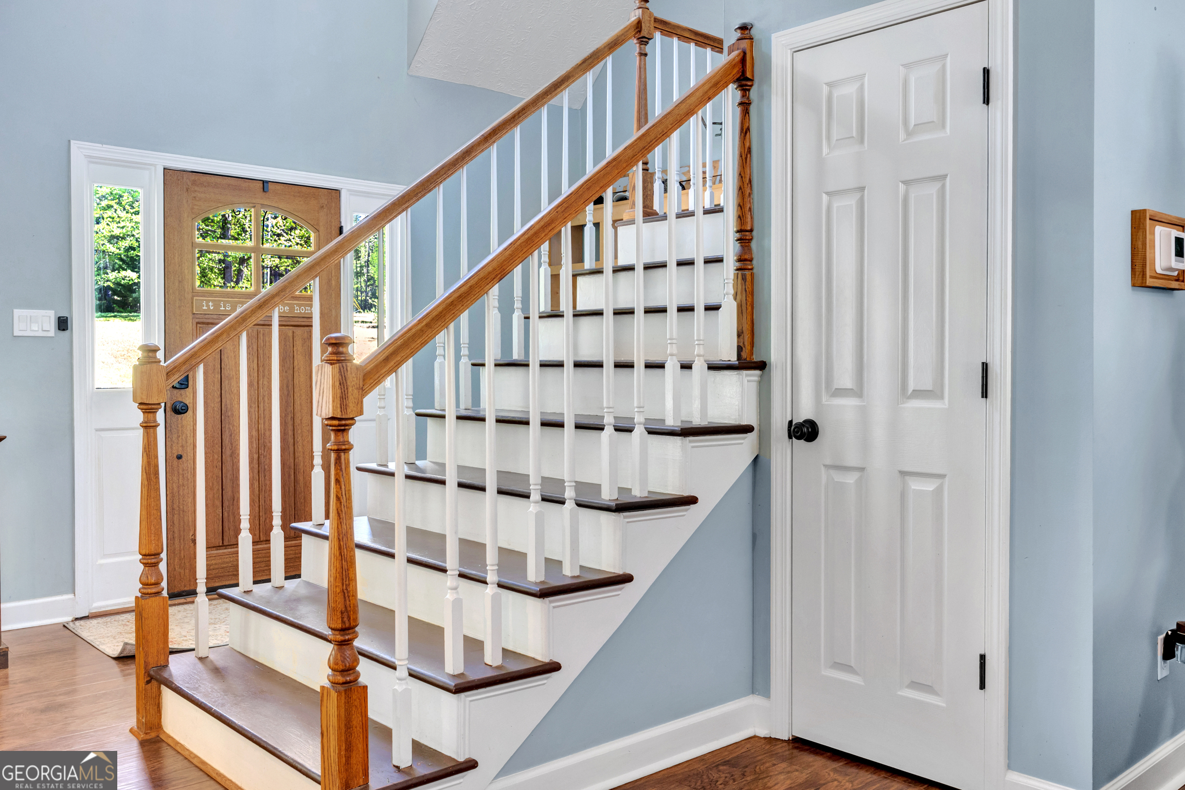 115 Crestview Lane Newborn, GA 30056 - Photo 14 of 53 a view of staircase with wooden floor and white walls