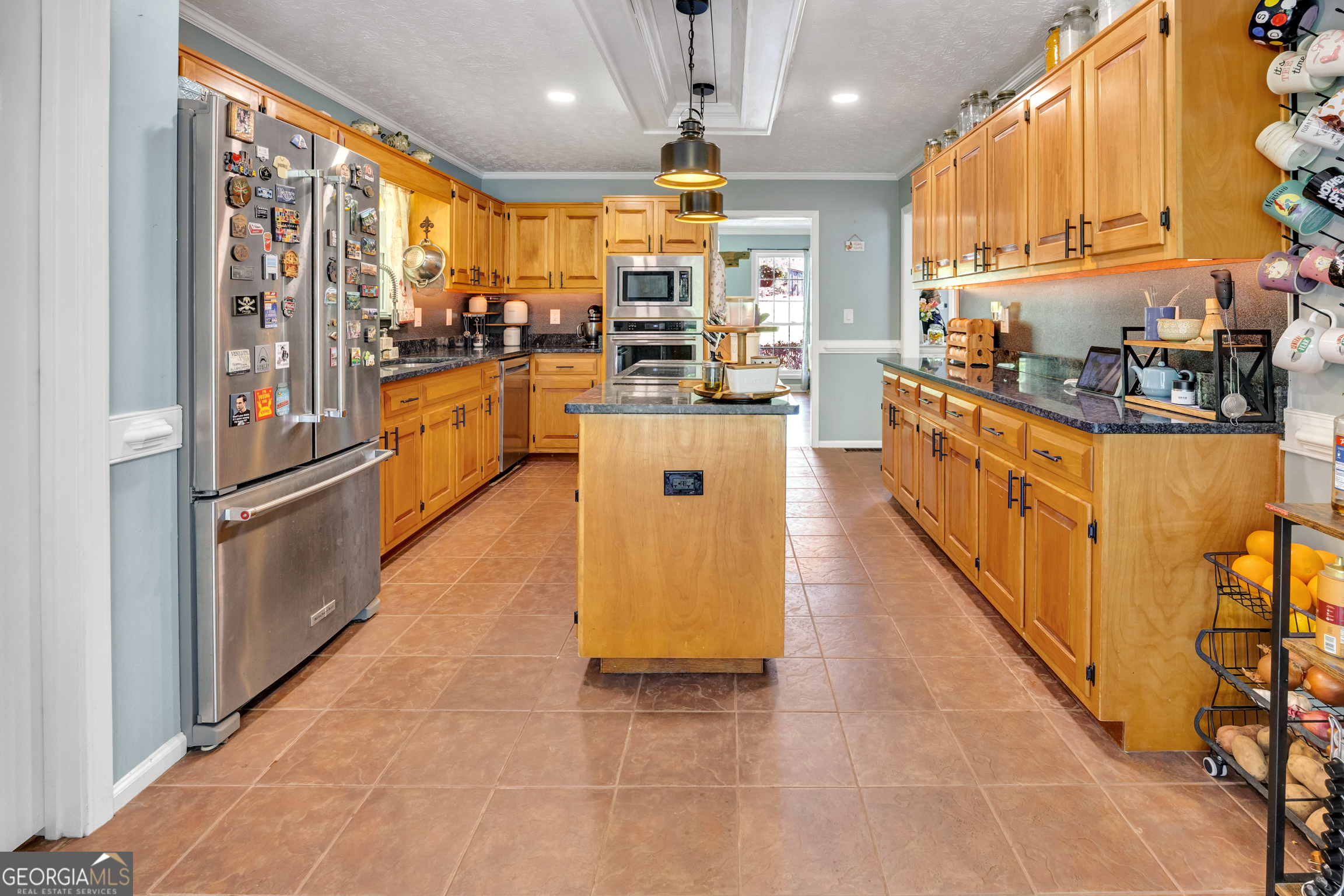 115 Crestview Lane Newborn, GA 30056 - Photo 18 of 53 a kitchen with stainless steel appliances granite countertop a refrigerator a sink dishwasher and white cabinets with wooden floor