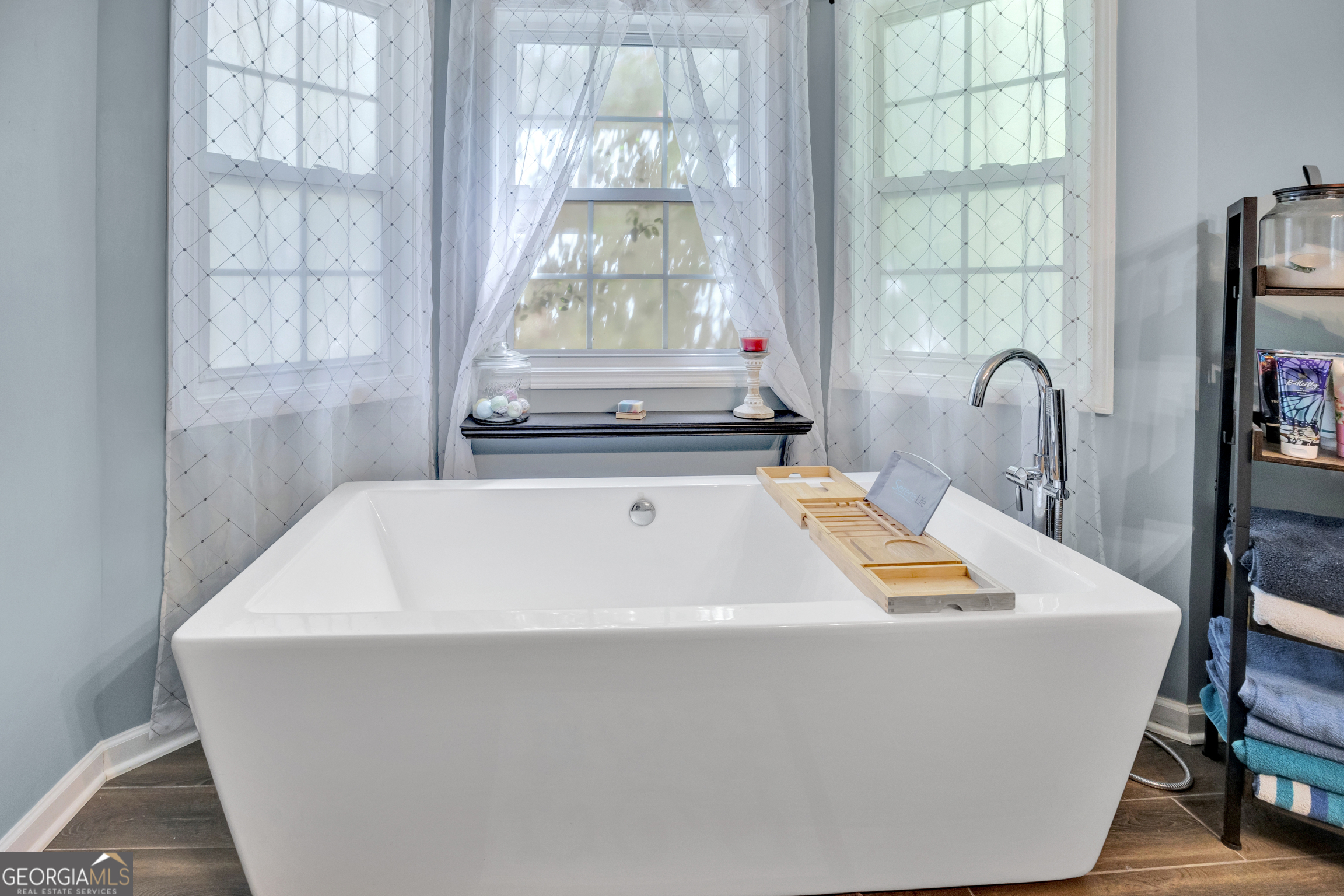 115 Crestview Lane Newborn, GA 30056 - Photo 23 of 53 a bath tub sitting in a bathroom next to a window