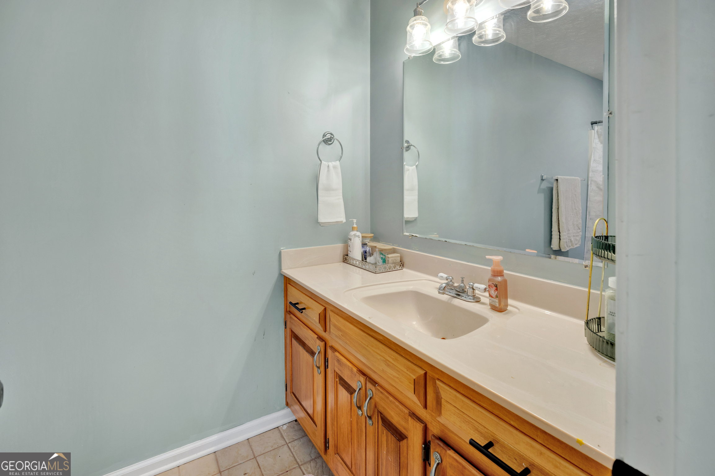 115 Crestview Lane Newborn, GA 30056 - Photo 33 of 53 a bathroom with a sink a vanity and a mirror