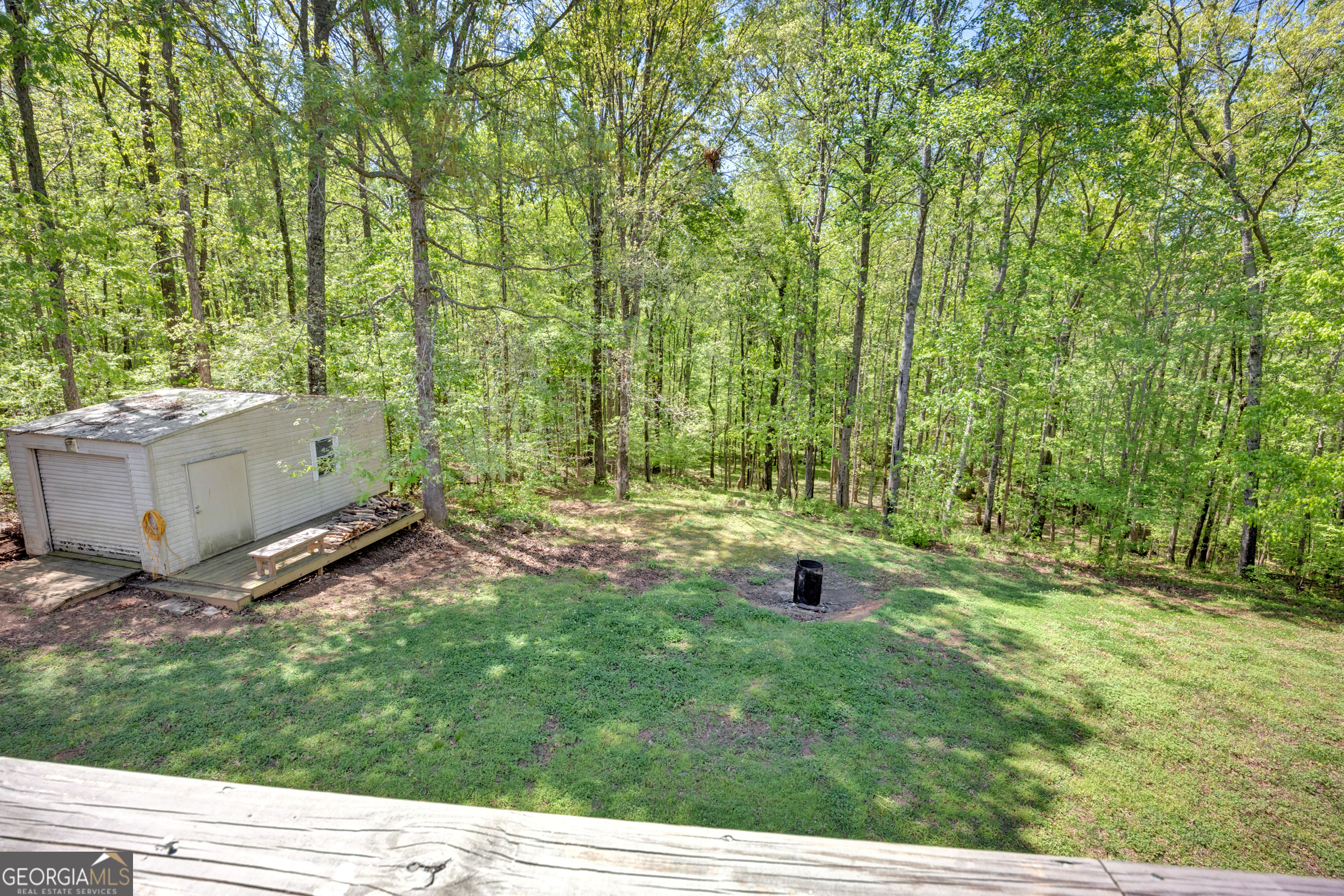115 Crestview Lane Newborn, GA 30056 - Photo 36 of 53 a backyard of a house with a yard and outdoor seating