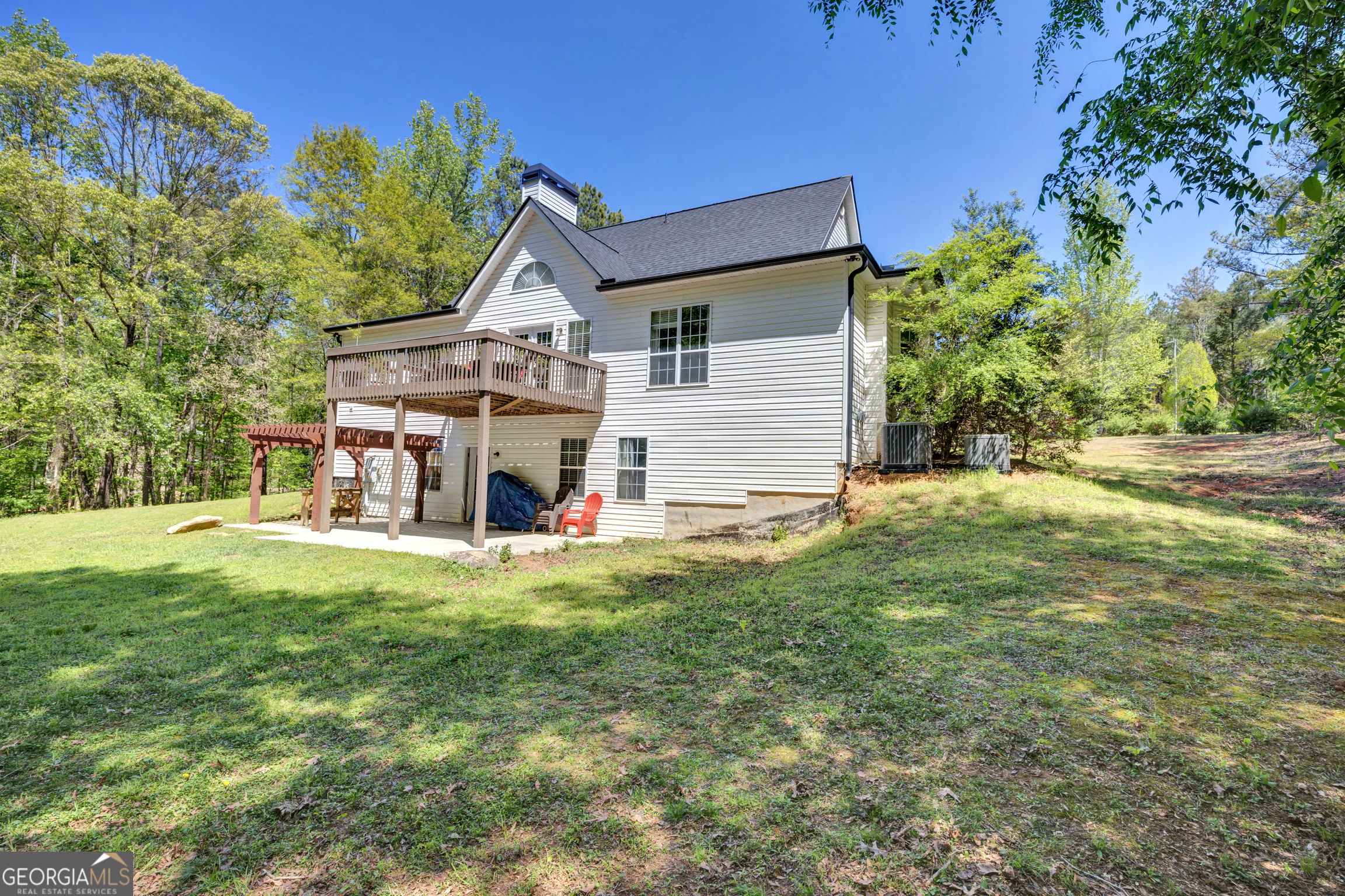 115 Crestview Lane Newborn, GA 30056 - Photo 43 of 53 a view of a house with a big yard and large trees