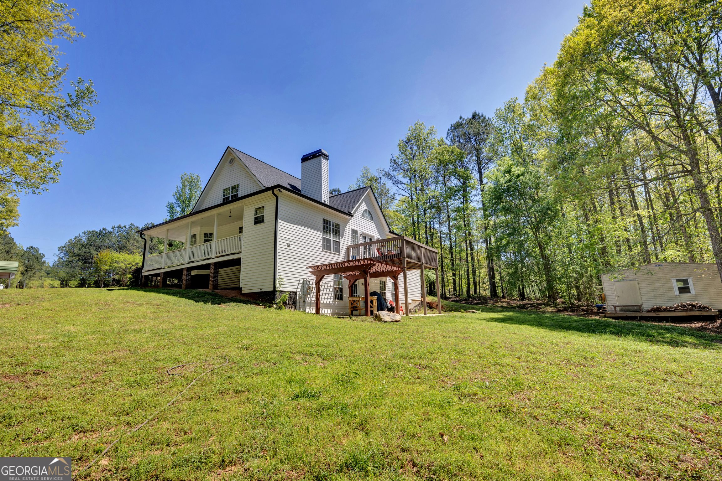 115 Crestview Lane Newborn, GA 30056 - Photo 46 of 53 a front view of a house with a yard