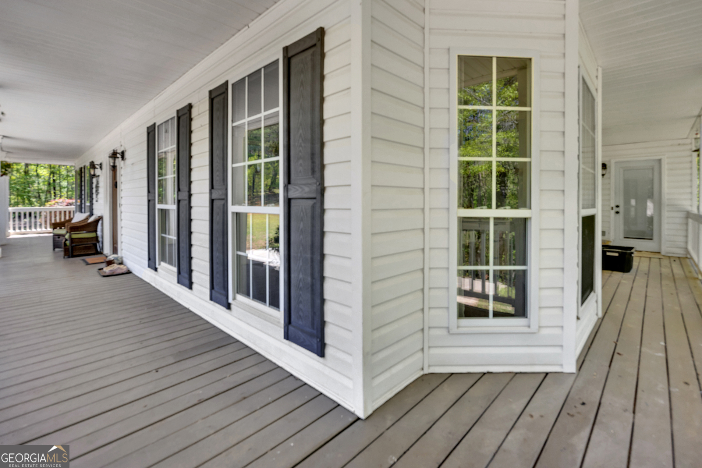 115 Crestview Lane Newborn, GA 30056 - Photo 48 of 53 a view of a balcony with wooden floor and furniture