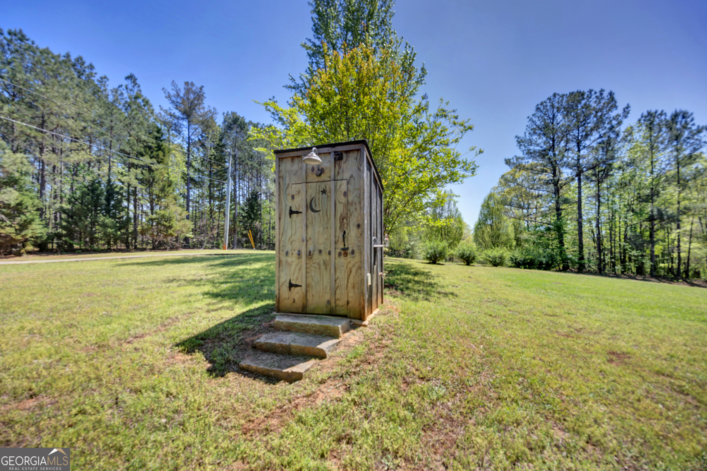 115 Crestview Lane Newborn, GA 30056 - Photo 52 of 53 a view of a backyard with large trees
