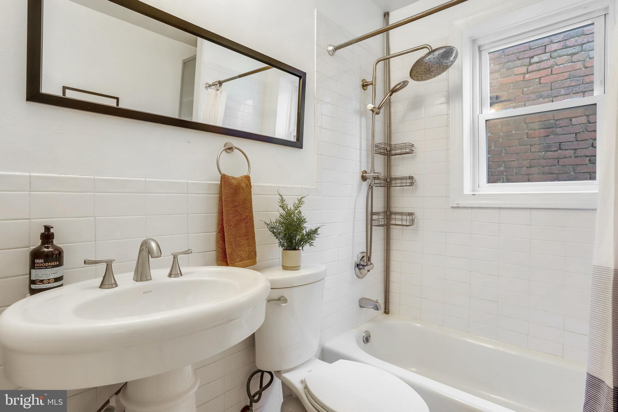 1630 6th Street Northwest Washington, DC 20001 - Photo 26 of 34 Subway-tiled hall bathroom upstairs has tub