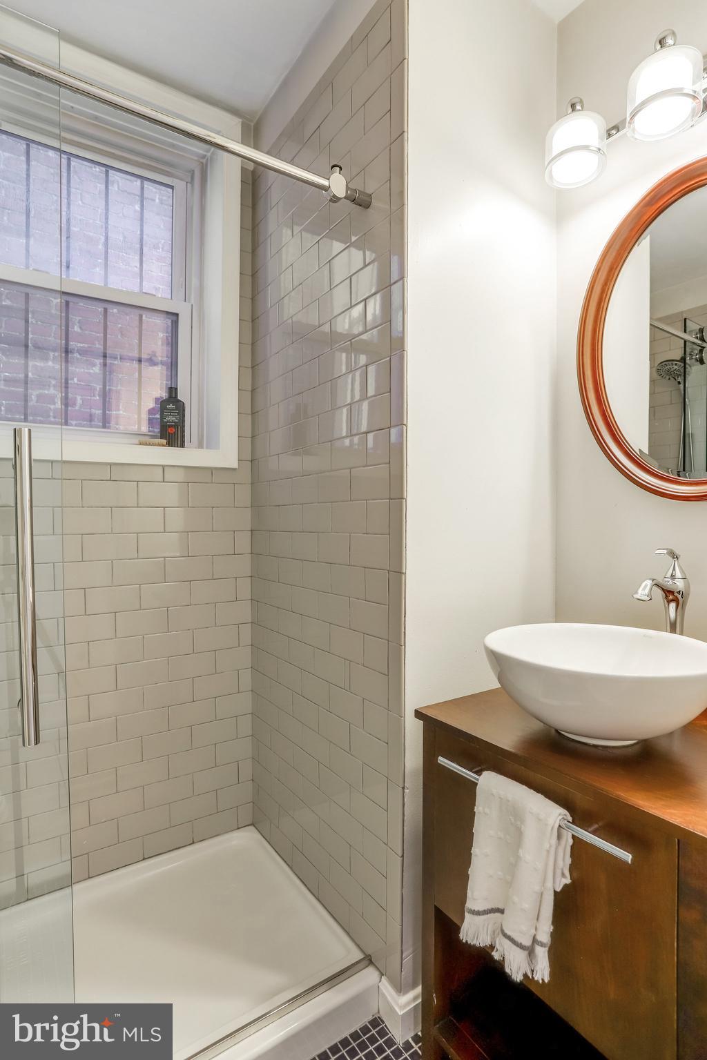 1630 6th Street Northwest Washington, DC 20001 - Photo 8 of 34 Main level full bath w/glass shower, subway tile