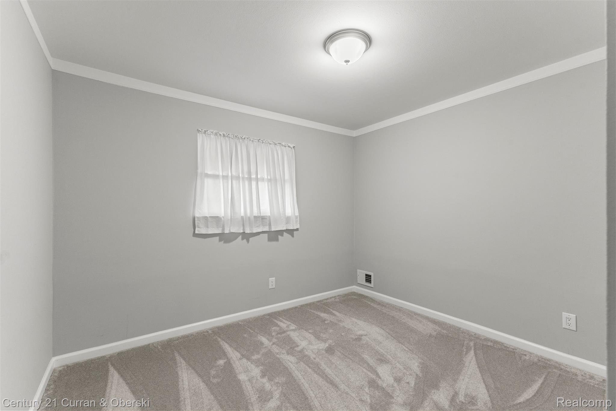 7120 Jackson Street Taylor, MI 48180 - Photo 7 of 24 Carpeted empty room with ornamental molding and baseboards