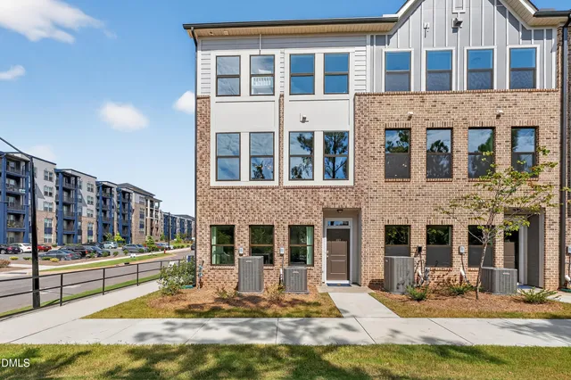 a view of a building with a yard