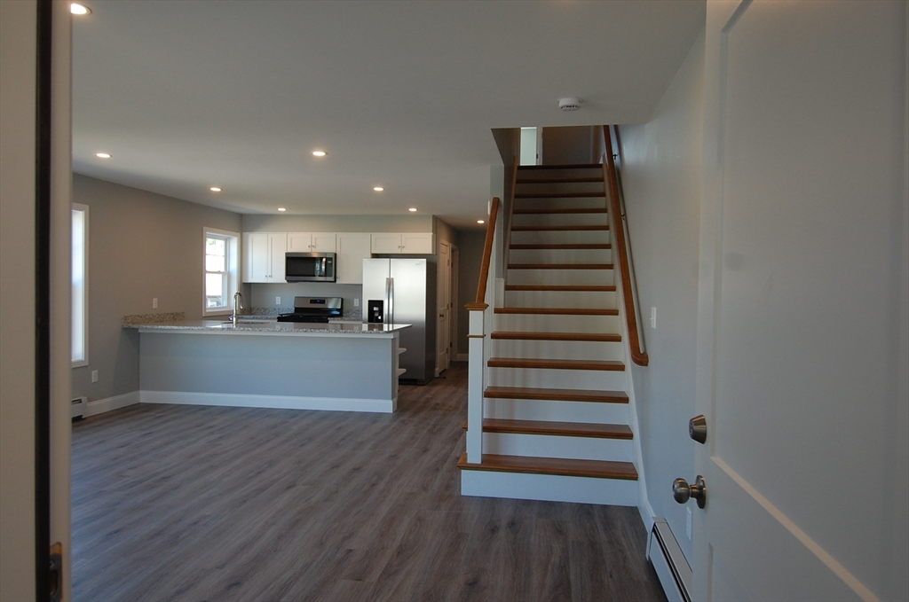 9 Bolton Road, Unit S Dartmouth, MA 02748 - Photo 2 of 19 a view of kitchen and hall with wooden floor