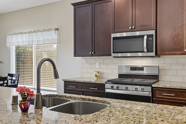 a kitchen with a stove and a microwave