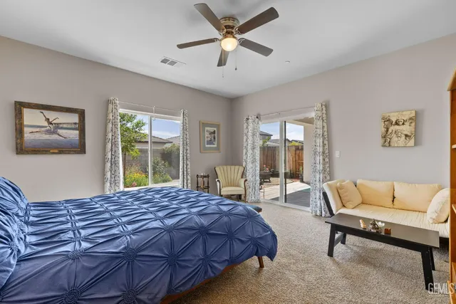 a bedroom with a bed and a couch