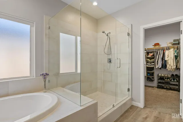 a bathroom with a shower and a bathtub