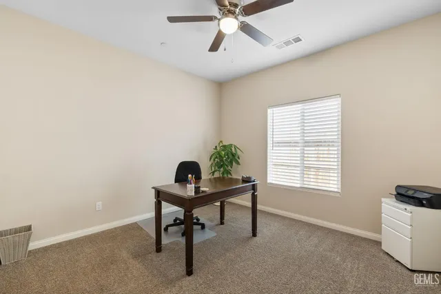 a workspace with furniture and a window