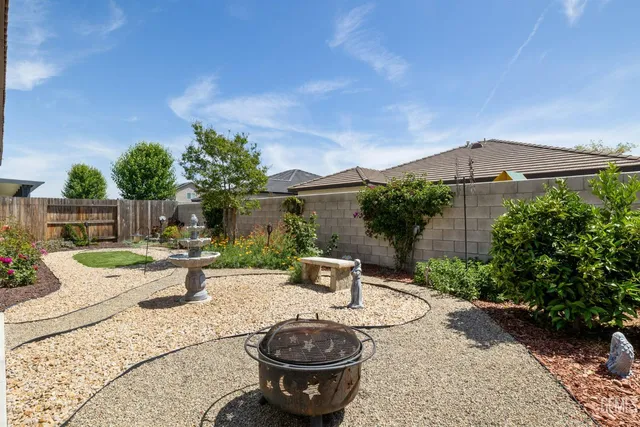 a view of a backyard with sitting area