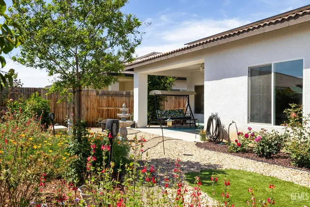 a view of a chairs and table in a patio