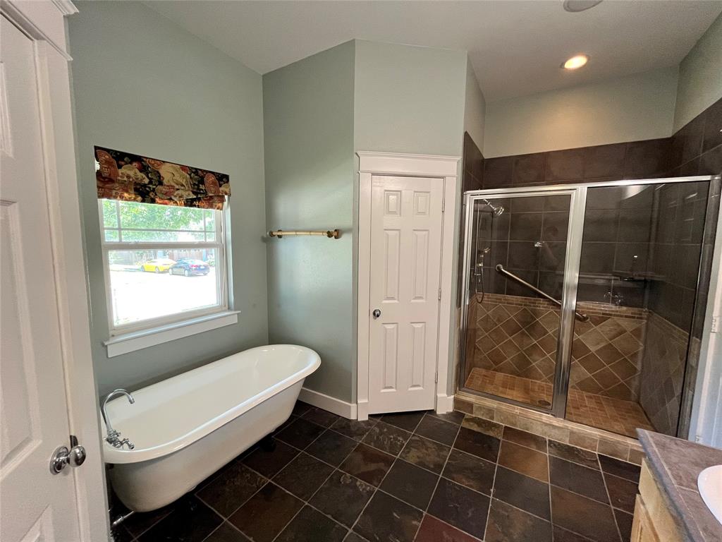 709 Roberts Street Denton, TX 76209 - Photo 15 of 35 Bright bathroom with updated vanity and tile flooring