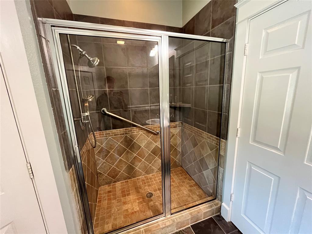 709 Roberts Street Denton, TX 76209 - Photo 16 of 35 Spacious shower with tiled walls