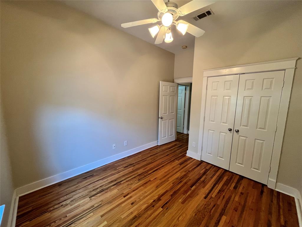 709 Roberts Street Denton, TX 76209 - Photo 22 of 35 Third bedroom featuring great natural light and wood flooring.