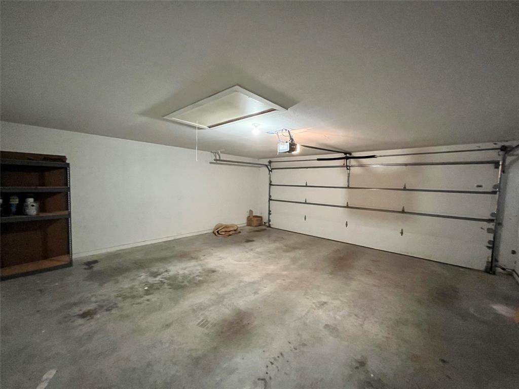 709 Roberts Street Denton, TX 76209 - Photo 28 of 35 Large, clean two-car garage with plenty of workspace.