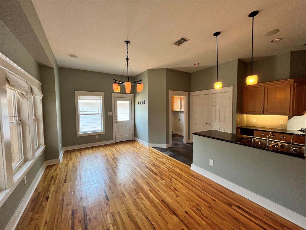 709 Roberts Street Denton, TX 76209 - Photo 5 of 35 Dining area that opens directly into the modern kitchen.
