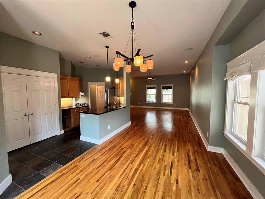 709 Roberts Street Denton, TX 76209 - Photo 35 of 35 Wide view of the kitchen and dining space showing the open floor plan.