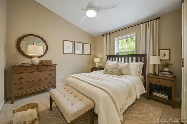 a bedroom with a bed and a dresser