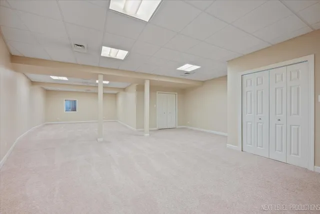 an empty room with a empty space and windows