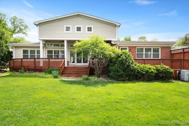 a view of outdoor space with wooden deck and furniture